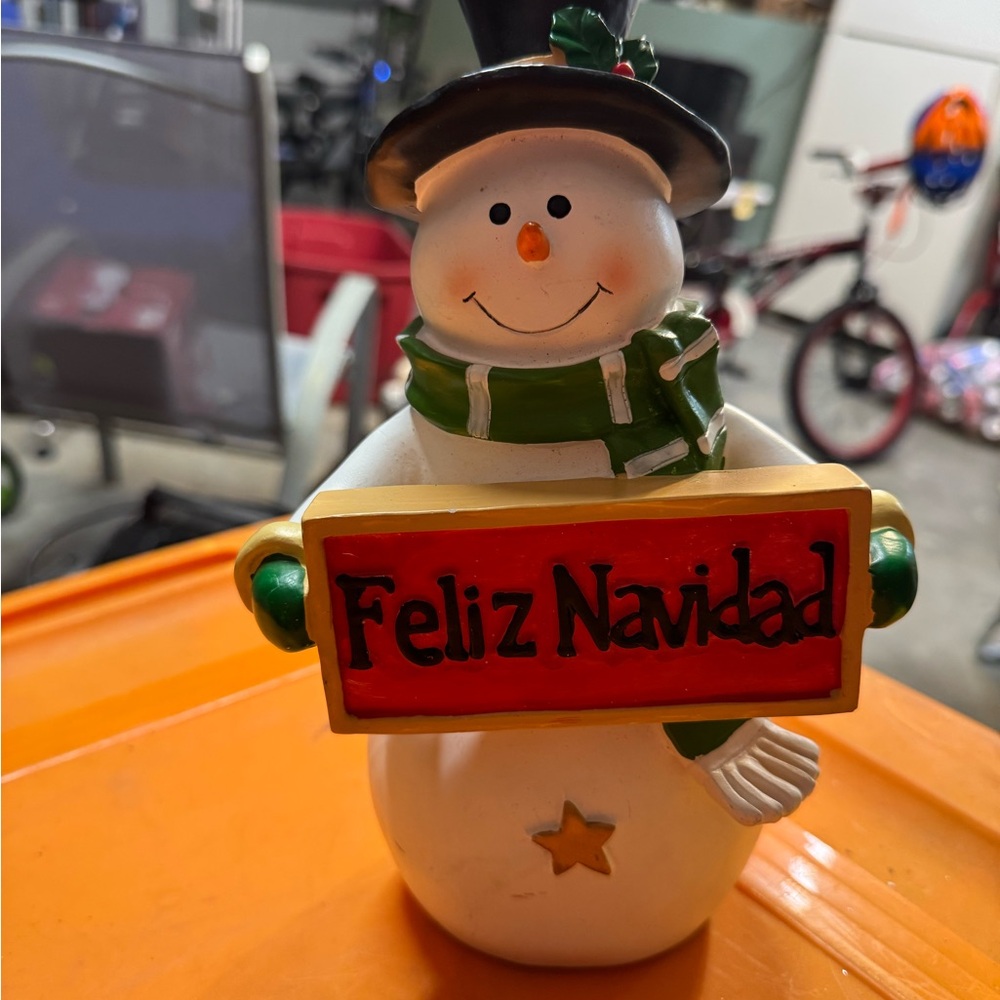 Festive Snowman Figurine with Green Scarf and Red Sign